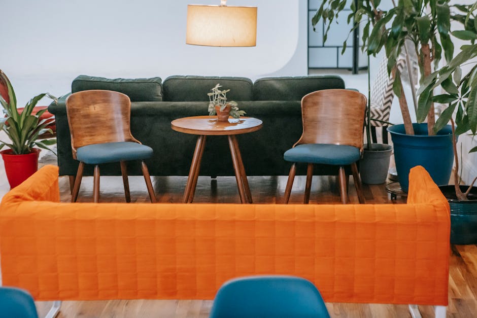 Stylish modern living room featuring wooden furniture and vibrant indoor plants creating a cozy, aspirational atmosphere