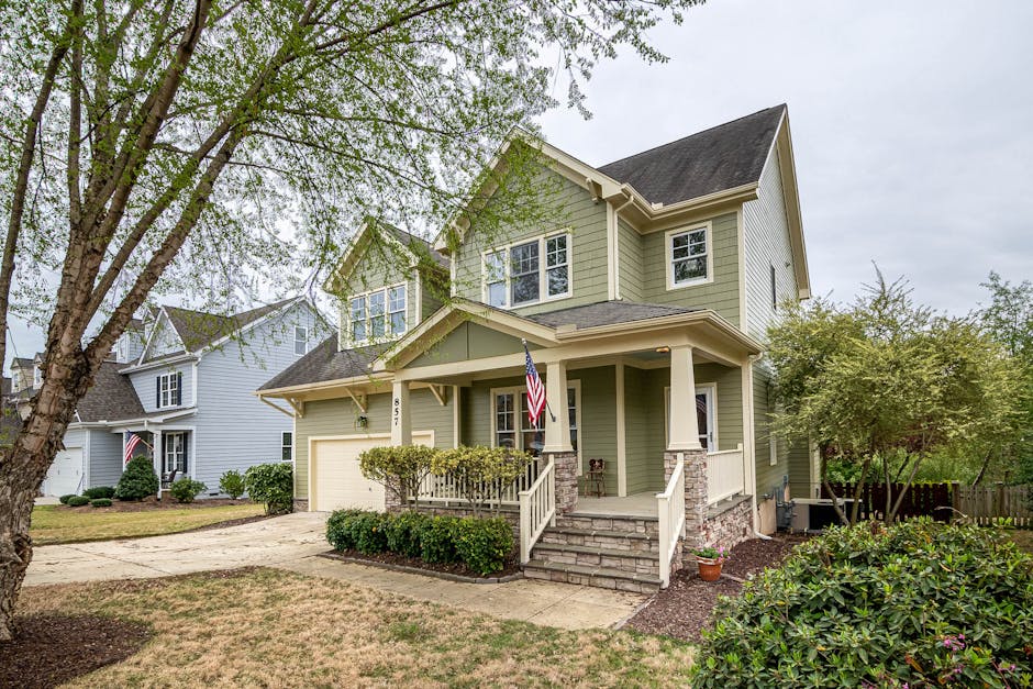 Suburban house with well-maintained front yard trees and landscaping