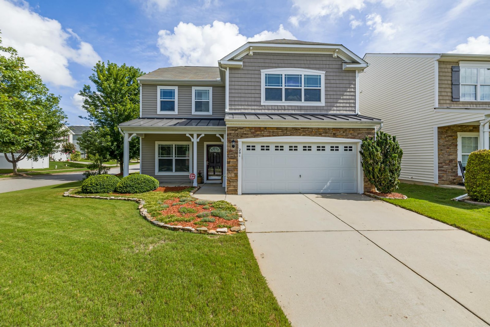 Mature trees in a residential front yard landscape